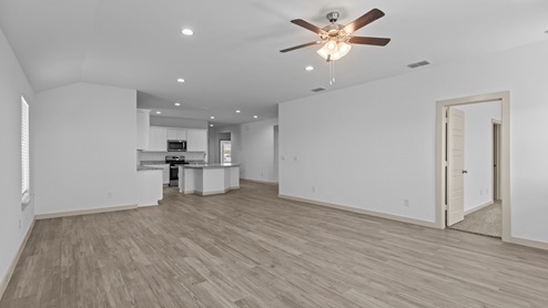 Spacious living and dining area with vinyl flooring