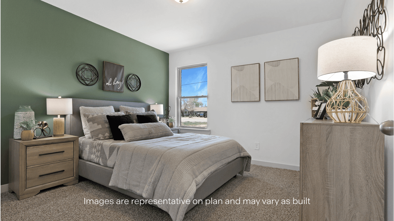 Guest bedroom with side window and plush carpet floor