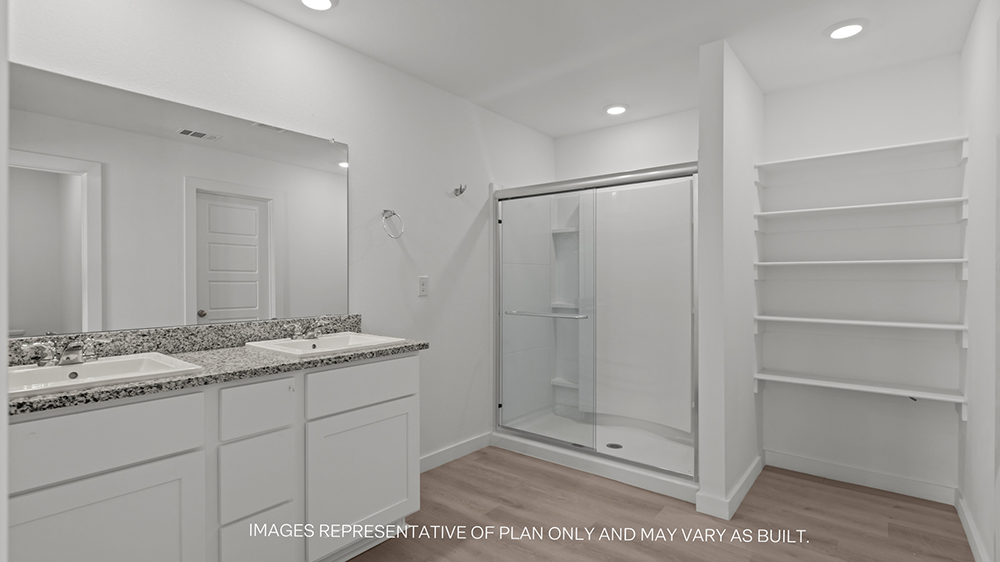 Interior bathroom with double sink, shower and shelving