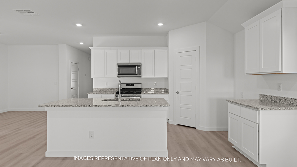 Interior kitchen with center island and white cabinets