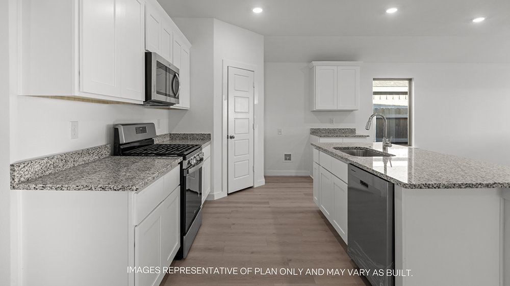 Interior kitchen with center island and white cabinets