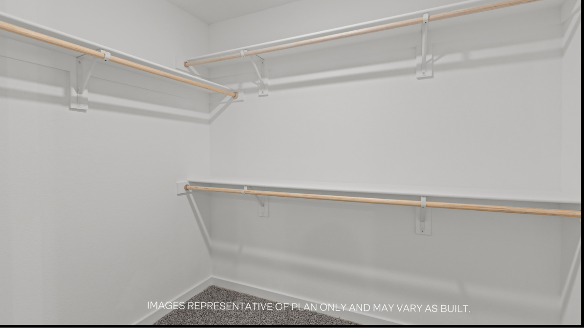 Primary walk-in closet with extra storage space