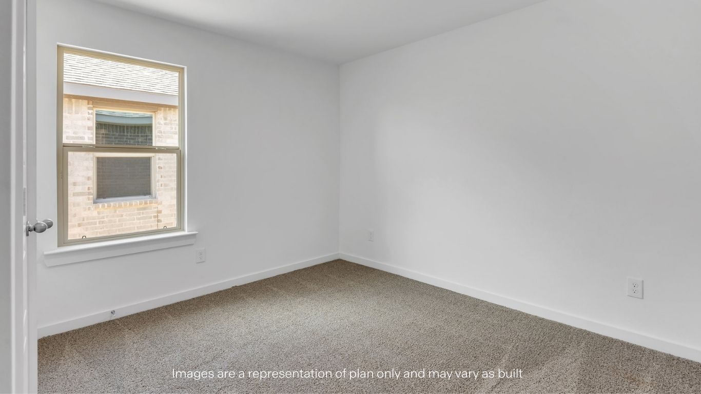 Guest bedroom 1 with side window and plush carpet floor
