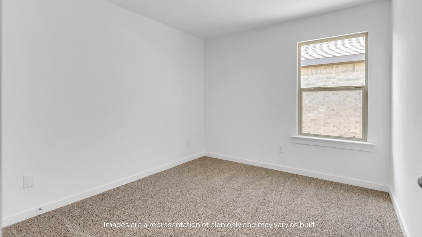 Guest bedroom 2 with side window and plush carpet floor