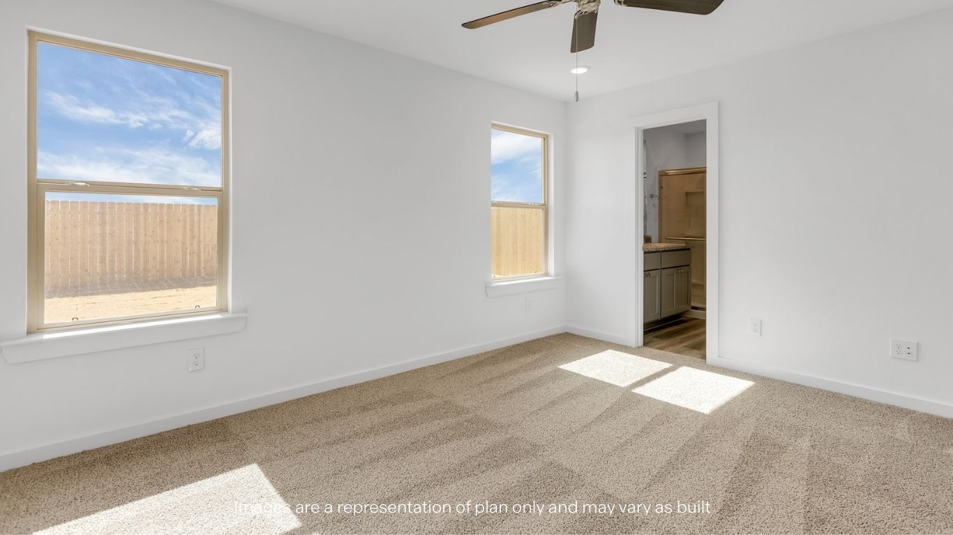 Primary bedroom with plush carpet floors and light allowing double windows