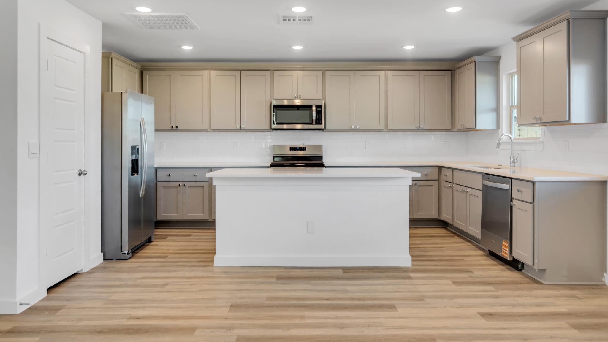 Open concept kitchen with extra counter and cabinet space