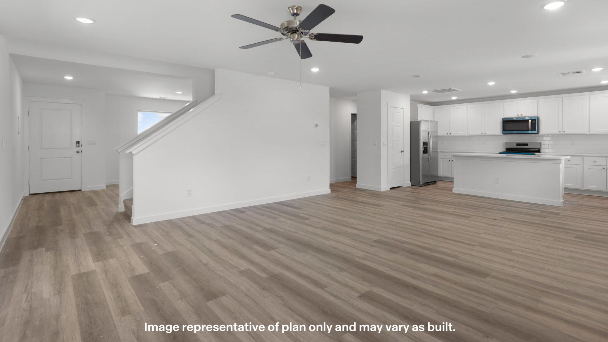 Spacious living and family room space with light allowing windows