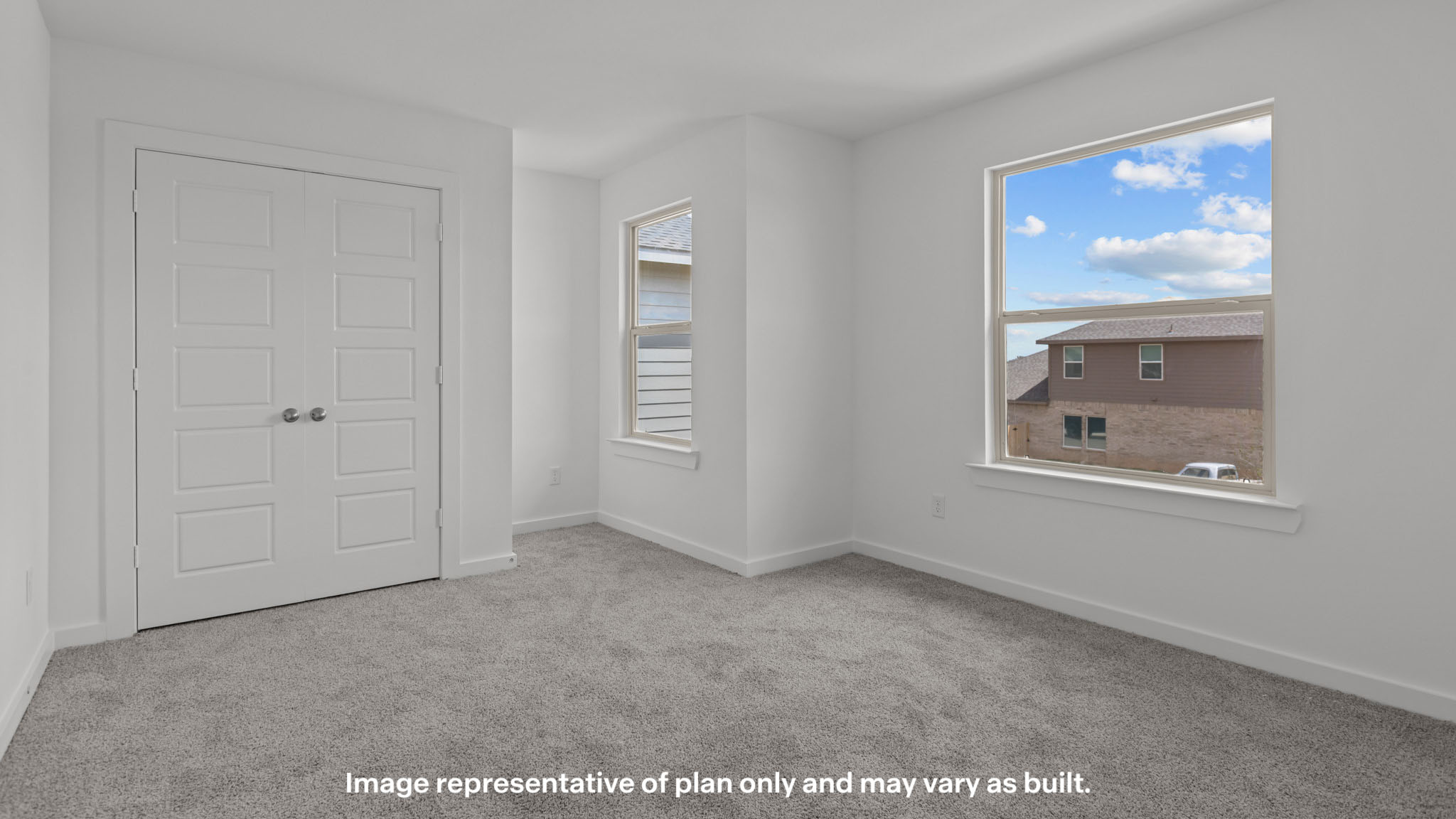 Upstairs guest bedroom 2 with plush carpet floors
