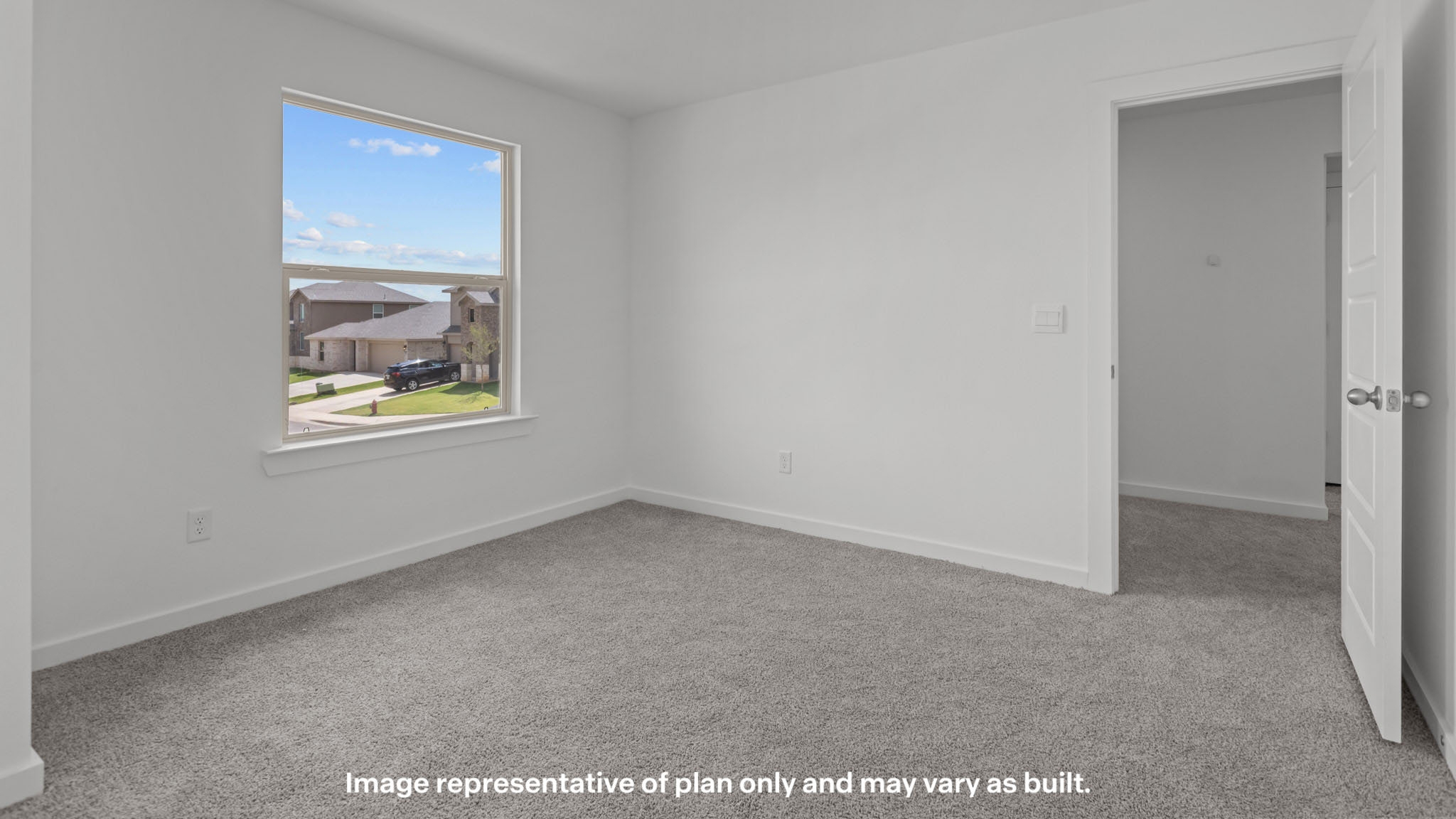 Upstairs guest bedroom 2 with plush carpet floors