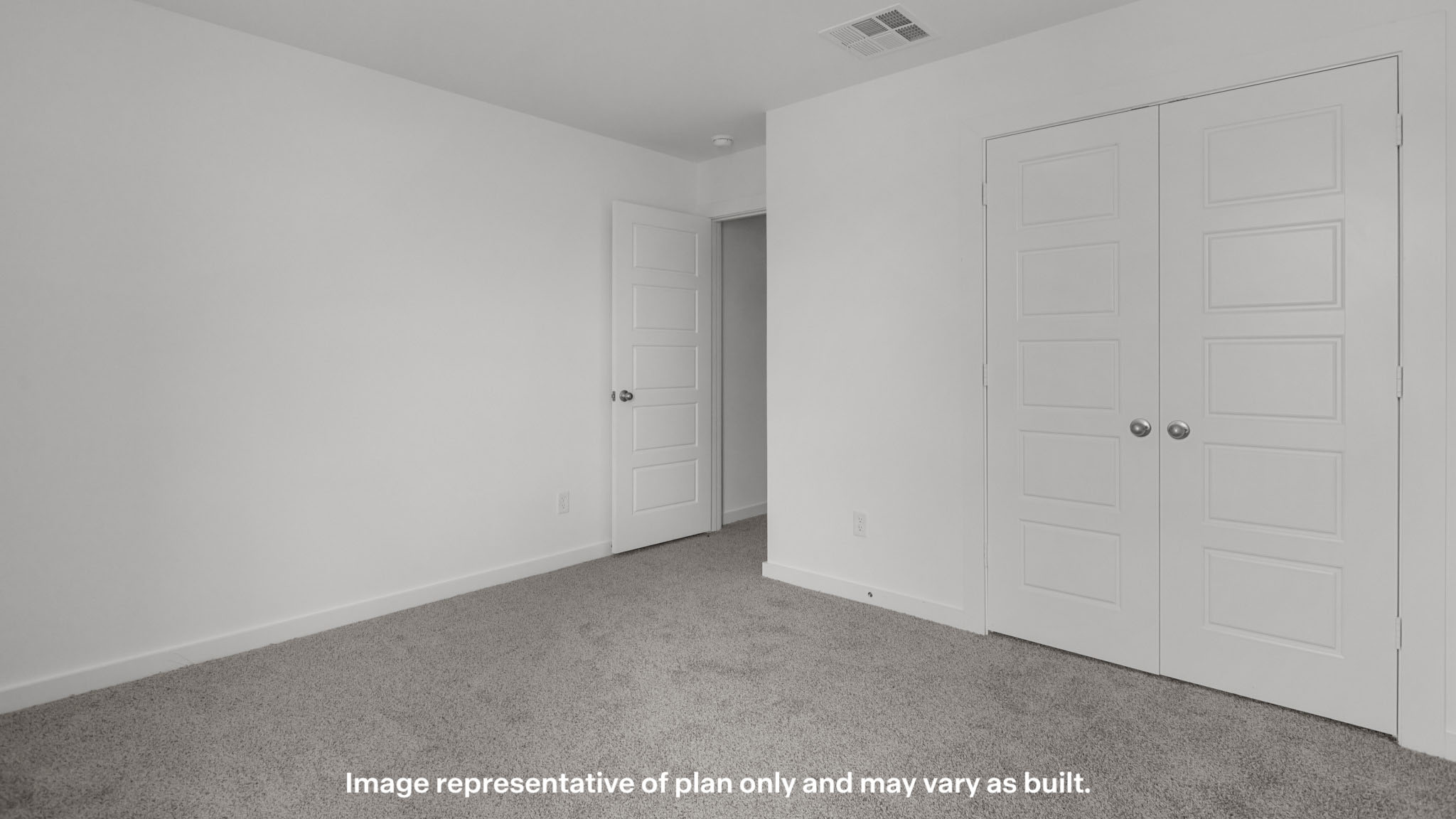 Upstairs guest bedroom 4 with plush carpet floors and front window