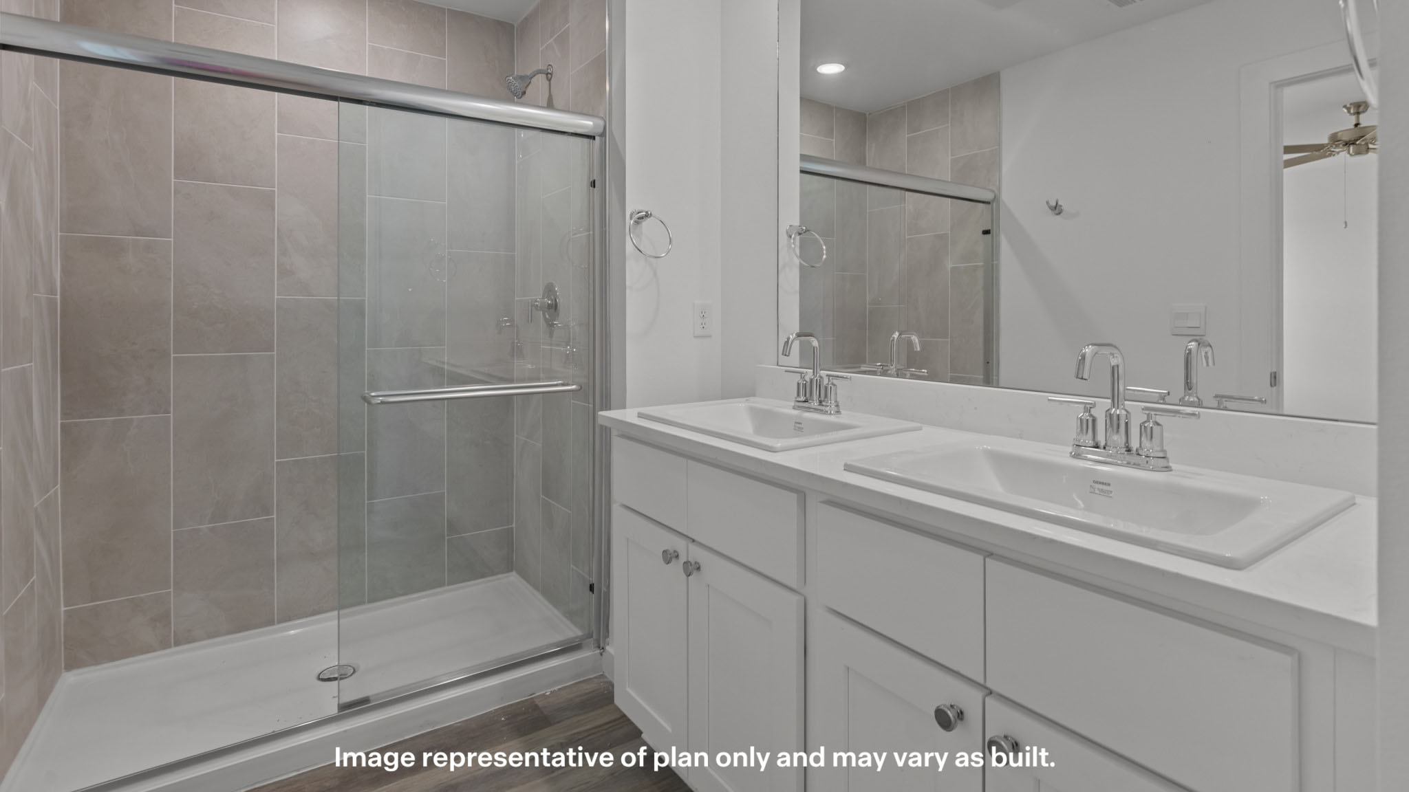 Primary bathroom with built in vanity and luxurious shower