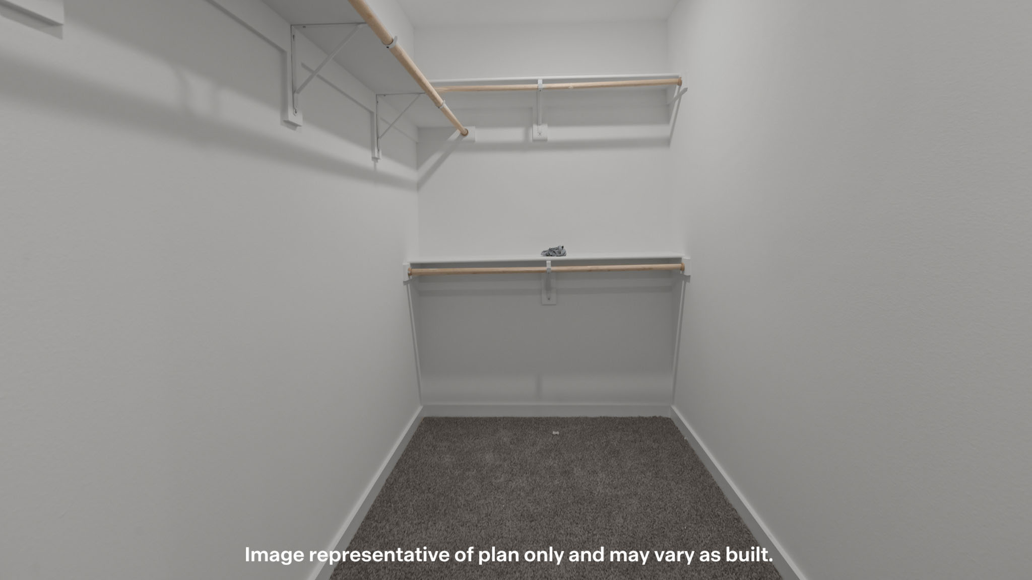 Private primary walk-in closet with extra storage space