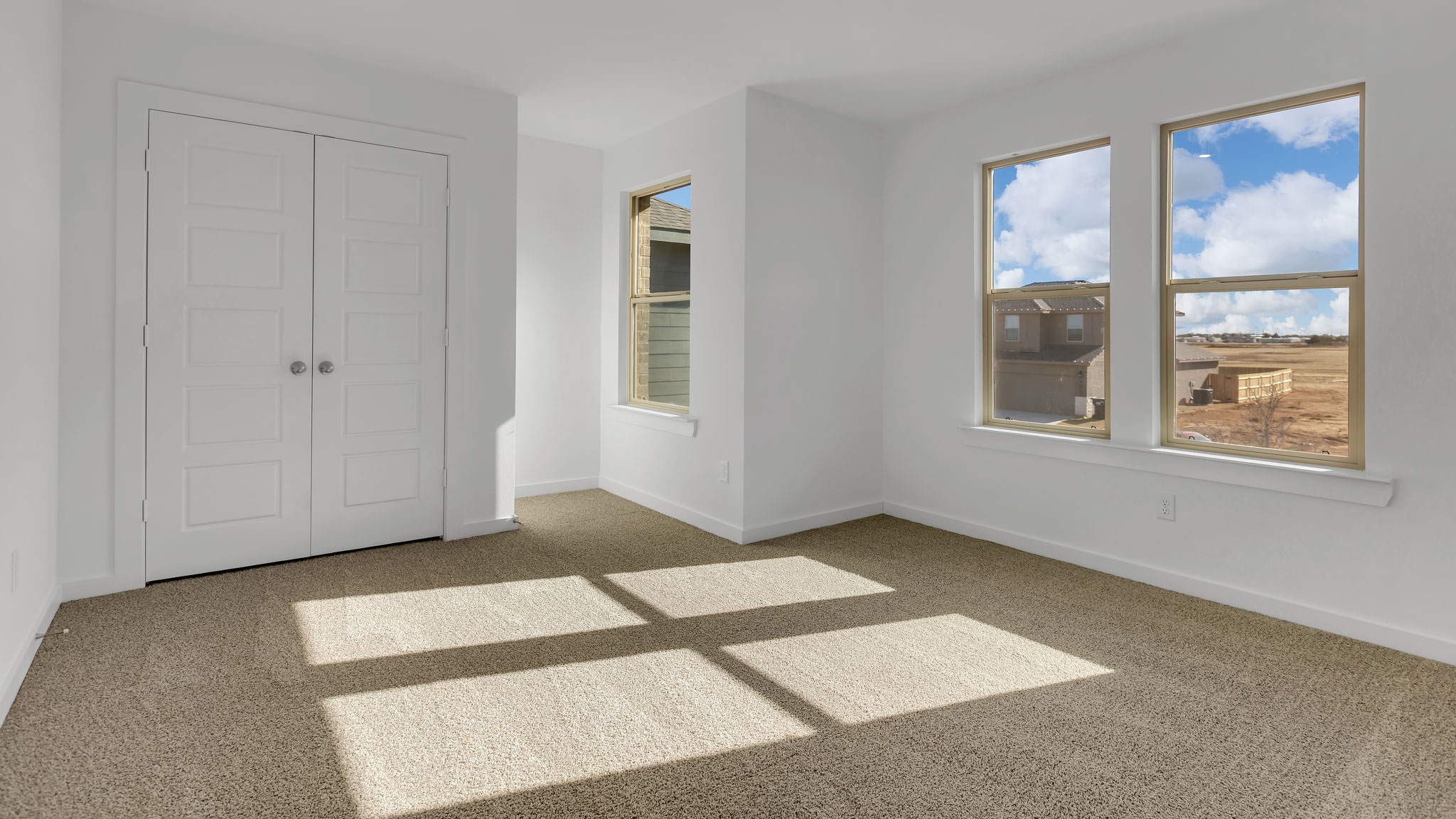 Upstairs bedroom 1 with front windows and spacious closet