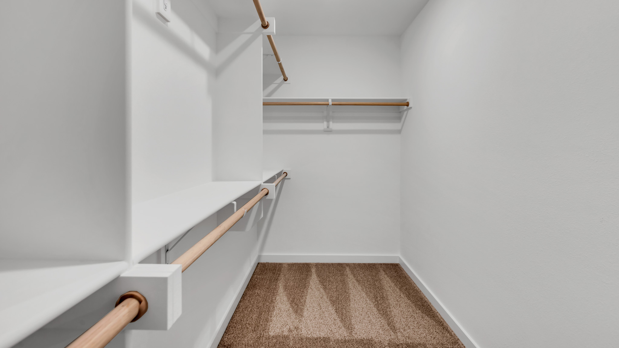 Primary walk in closet with extra storage space