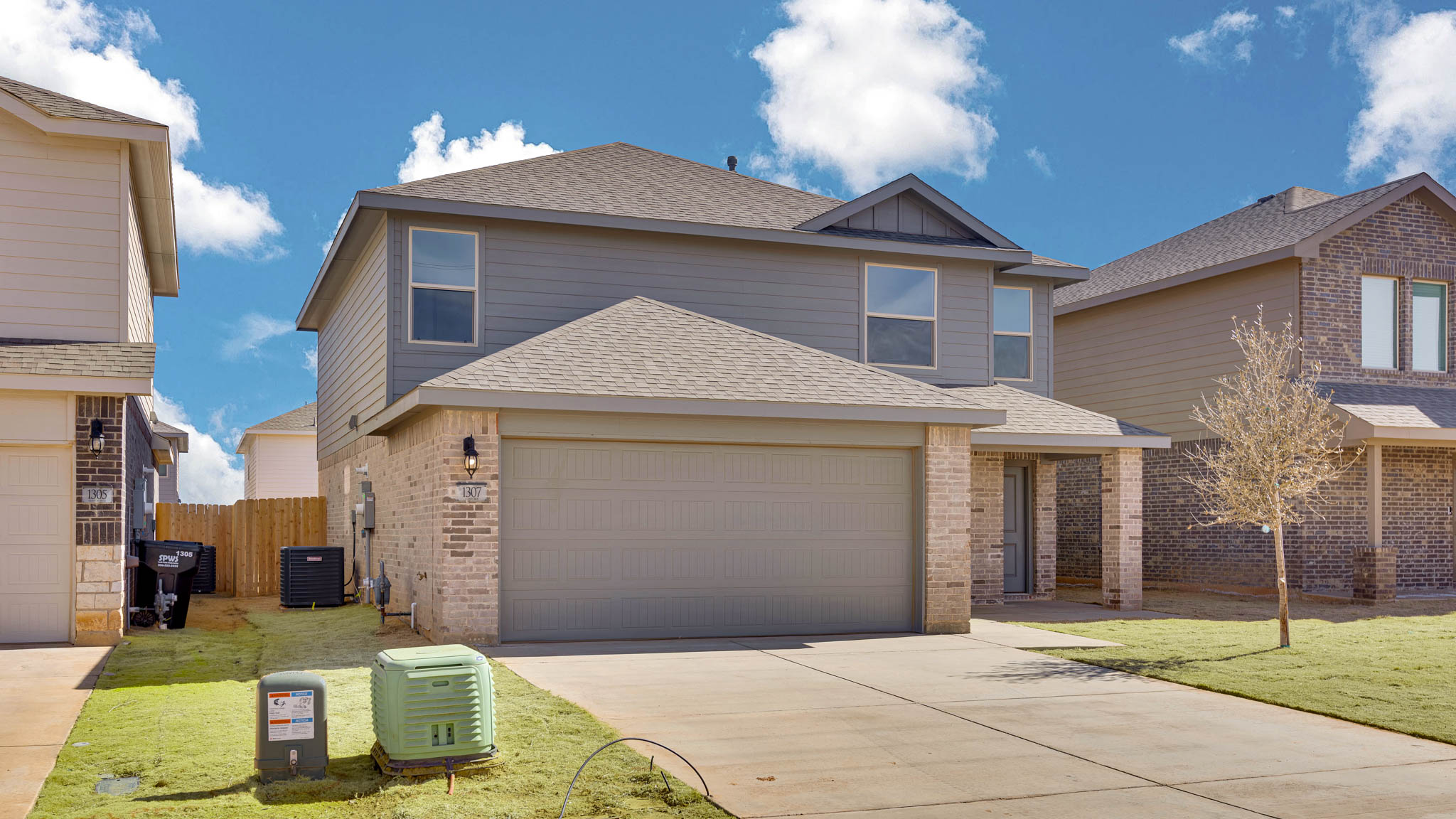 Side view of two story timeless brick home