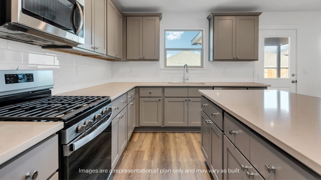 Open concept kitchen with stainless steel appliances, shaker style cabinets, and elevated finishes