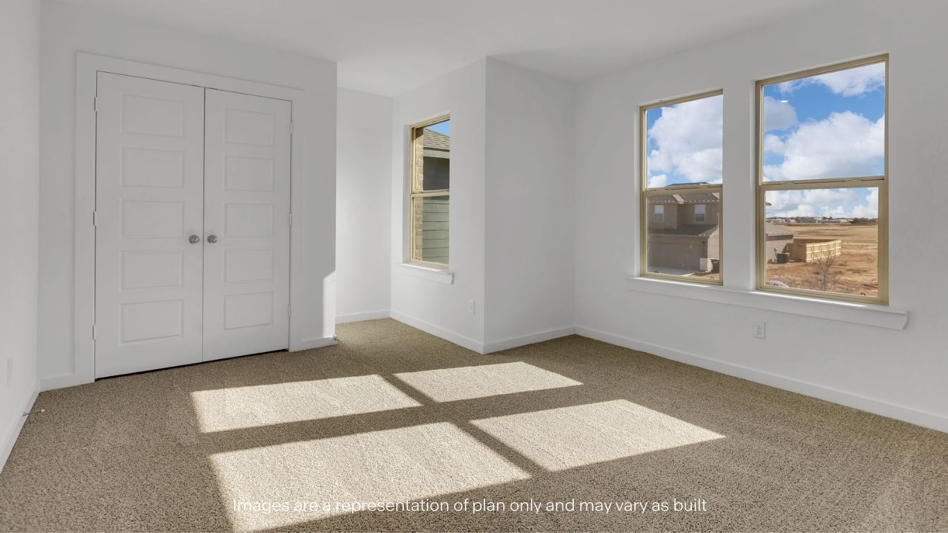 Guest bedroom 2 with front windows and ample natural light