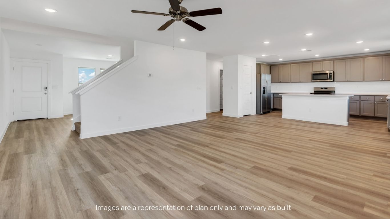 Living, dinning, and kitchen area with all wood floor