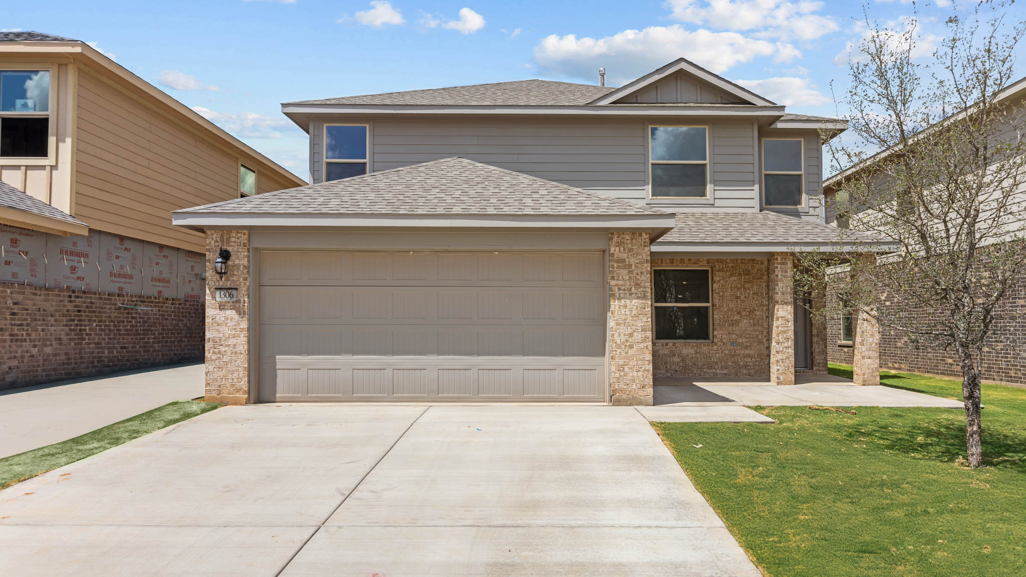 Exterior of two story modern brick home