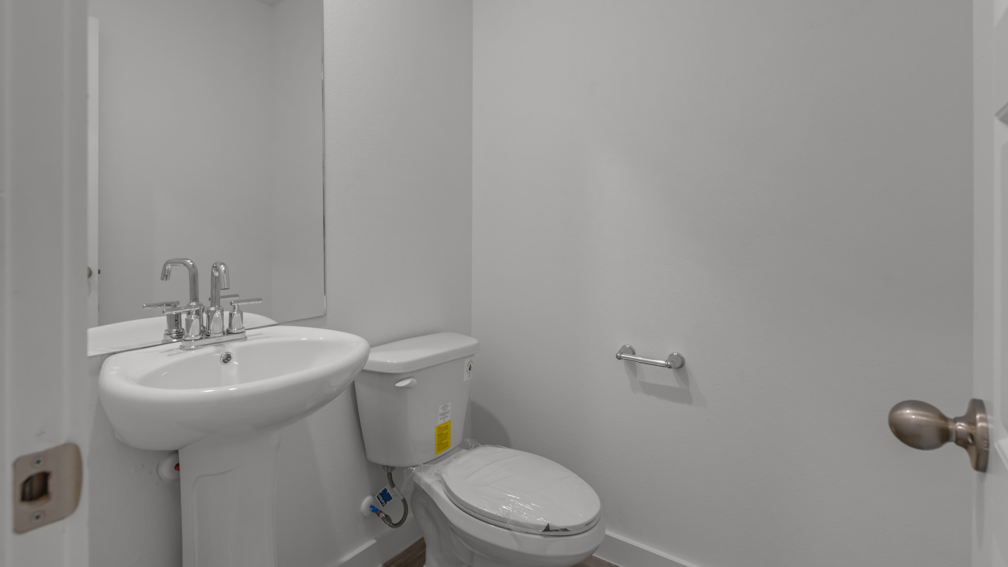 Half bathroom between common spaces