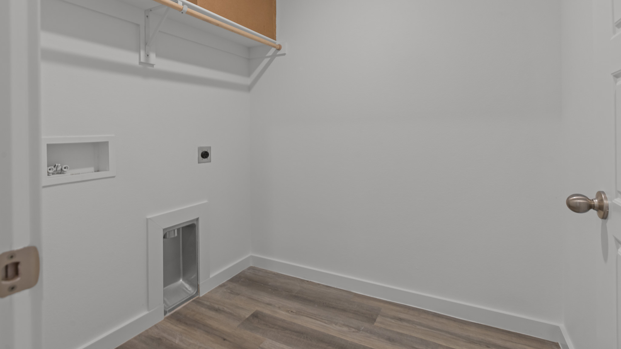 Laundry room and utility closet space with extra storage