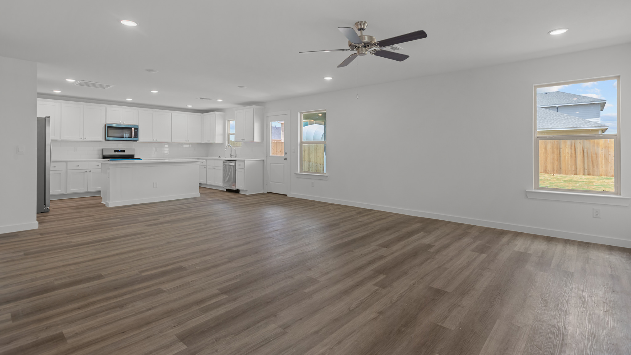 Open living and family room area with ample natural light