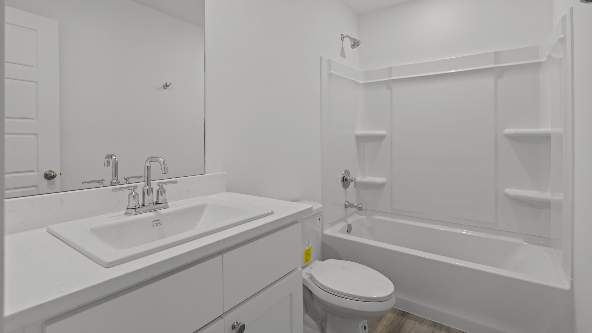 Upstairs guest bathroom with combination shower and bathtub