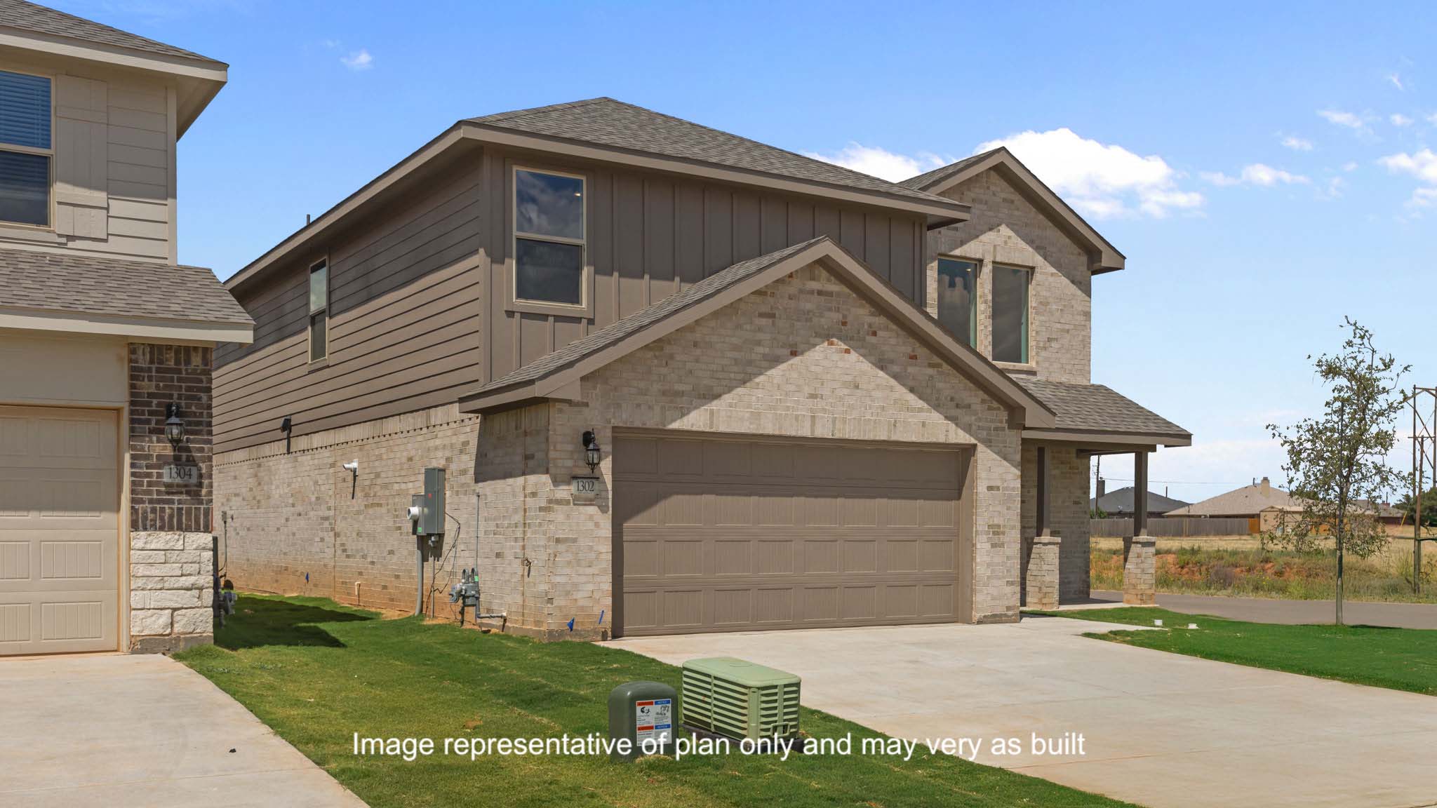 Side view of two story timeless brick home