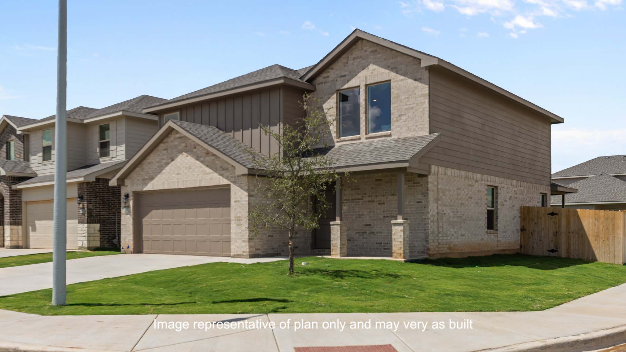 Side view of two story classic brick home