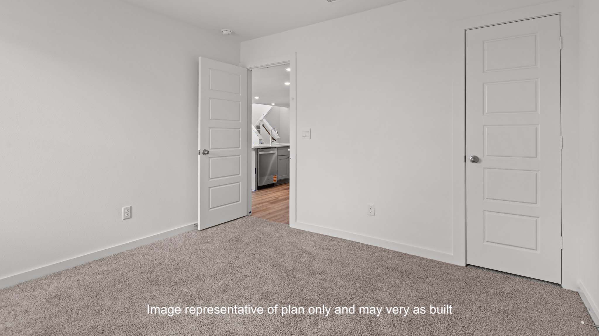 Down stairs Guest bedroom with spacious closet and plush carpet floors
