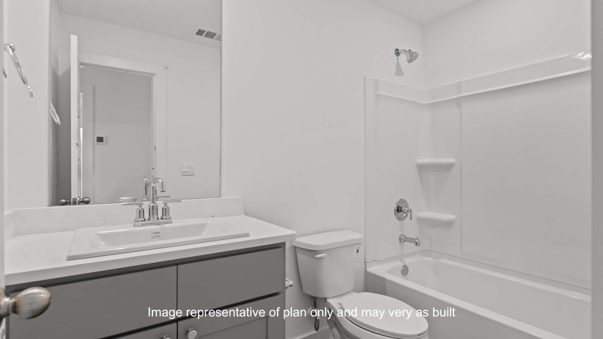 Guest bathroom with built in vanity and combination bathtub shower
