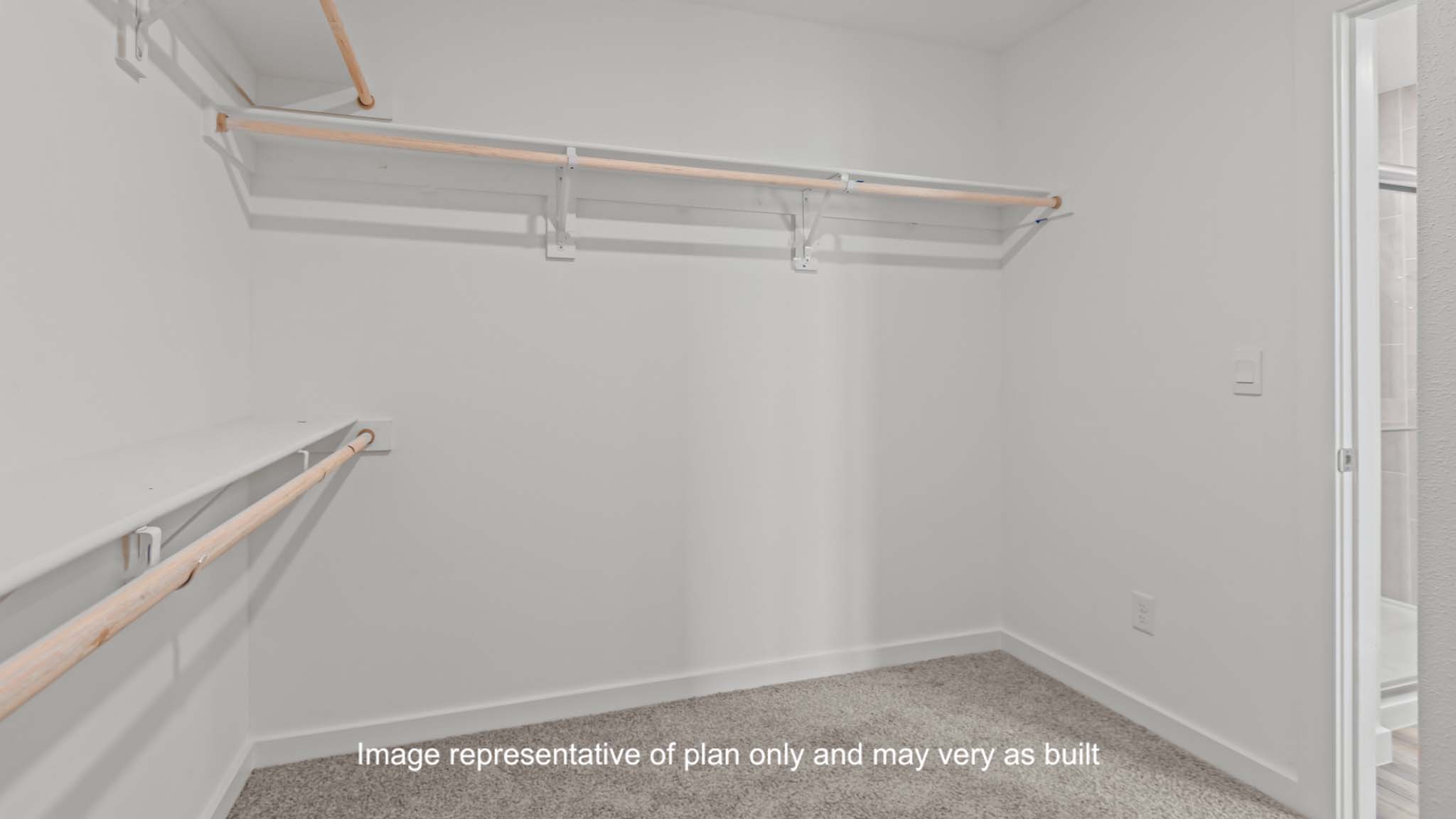 Primary walk-in closet with extra storage space