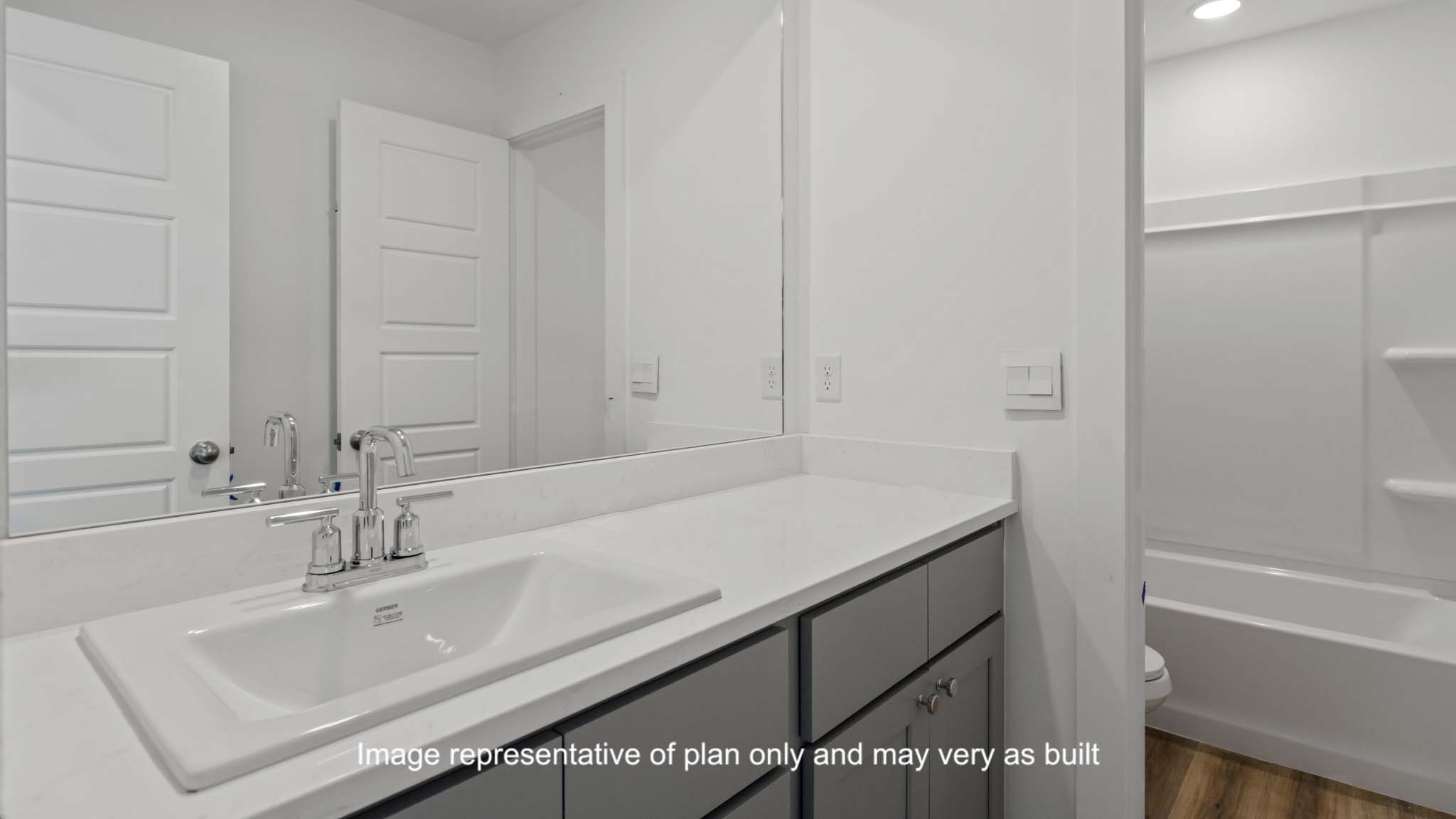 Guest bathroom located between guest bedrooms