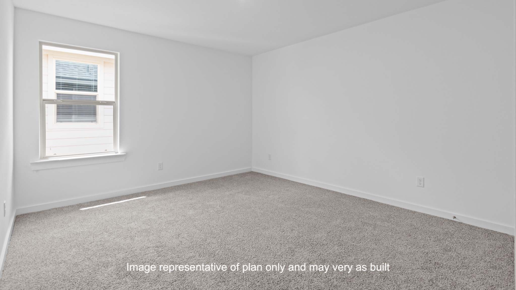 Guest bedroom with side window and plush carpet floor