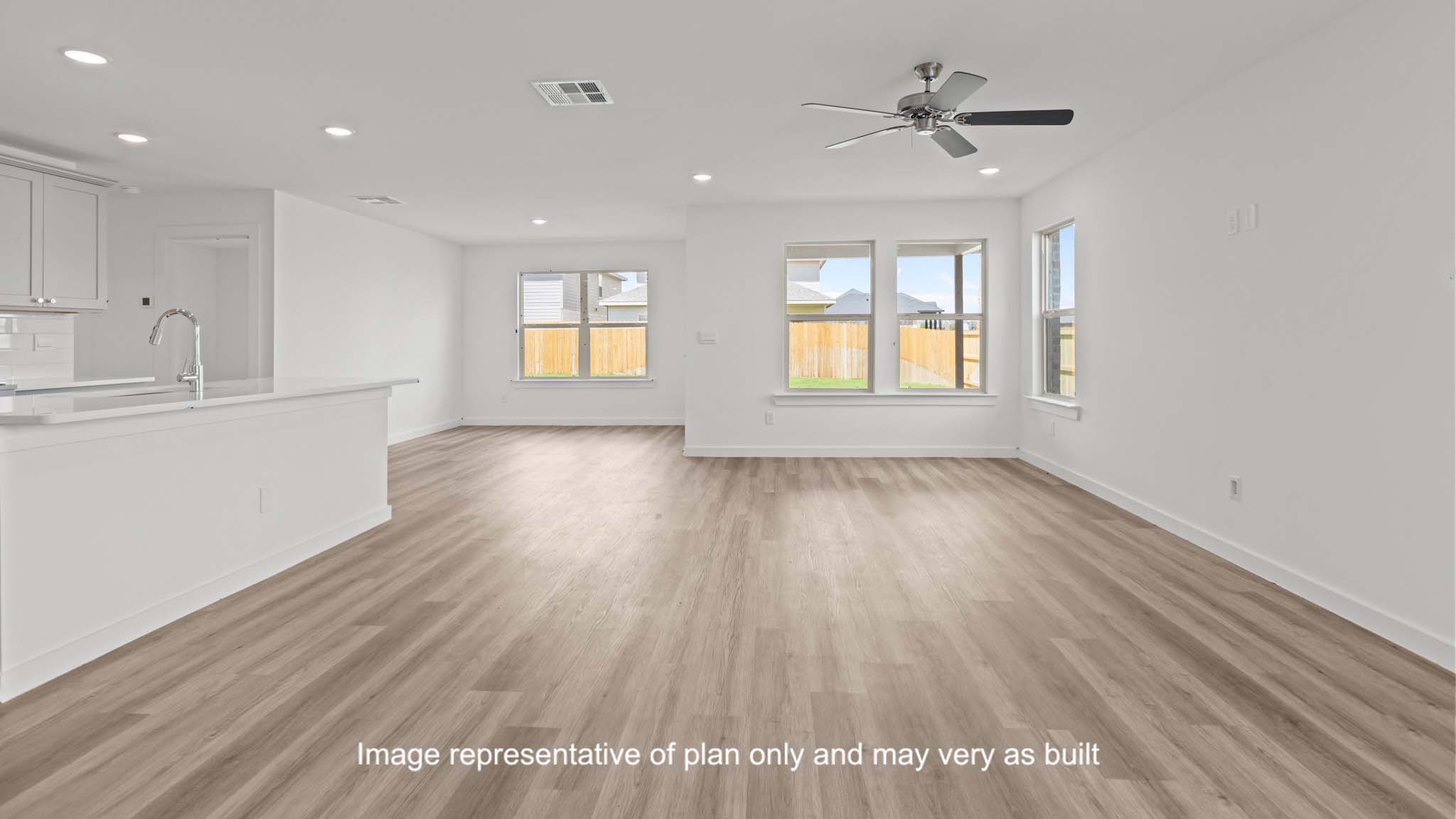 Open living and family room area with ample natural light
