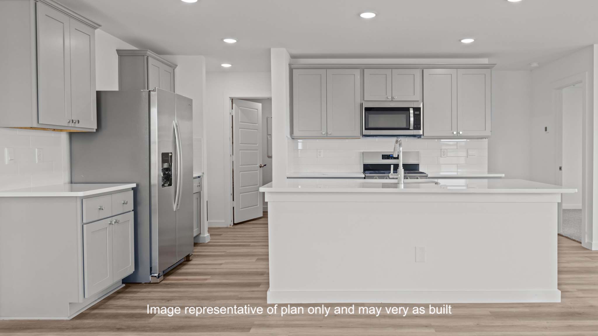 Spacious open concept kitchen with island and counter prep space