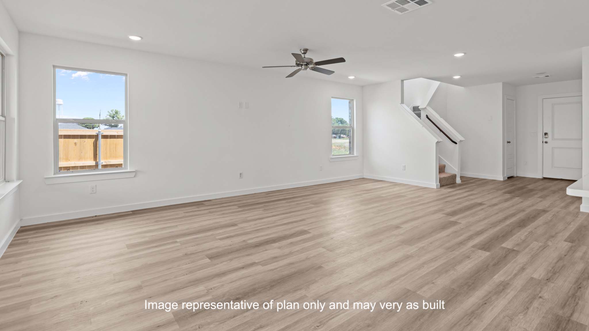 Open living and family room area with ample natural light