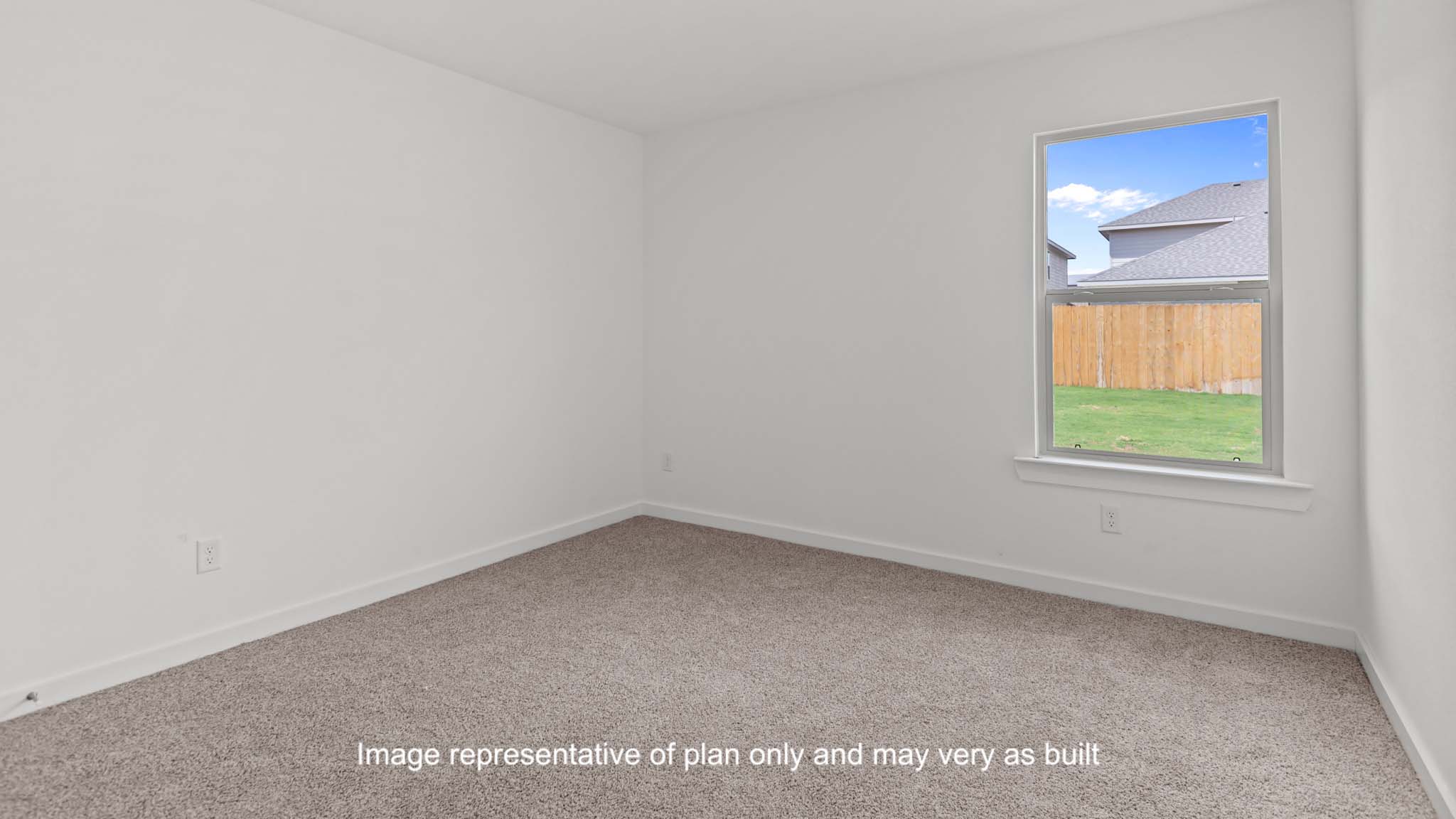 Down stairs Guest bedroom with side window and plush carpet floors