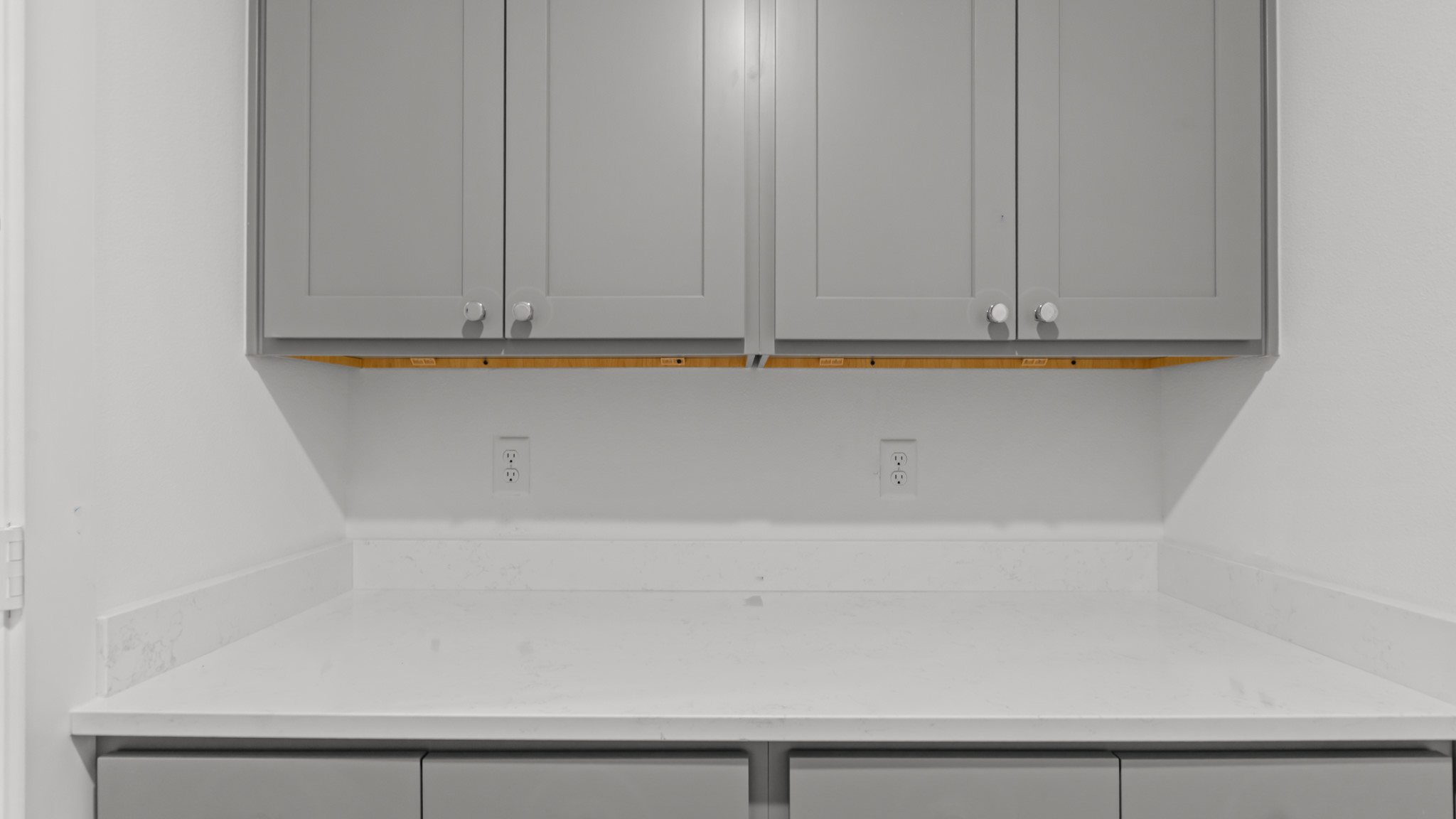 Laundry room and utility closet space with extra storage