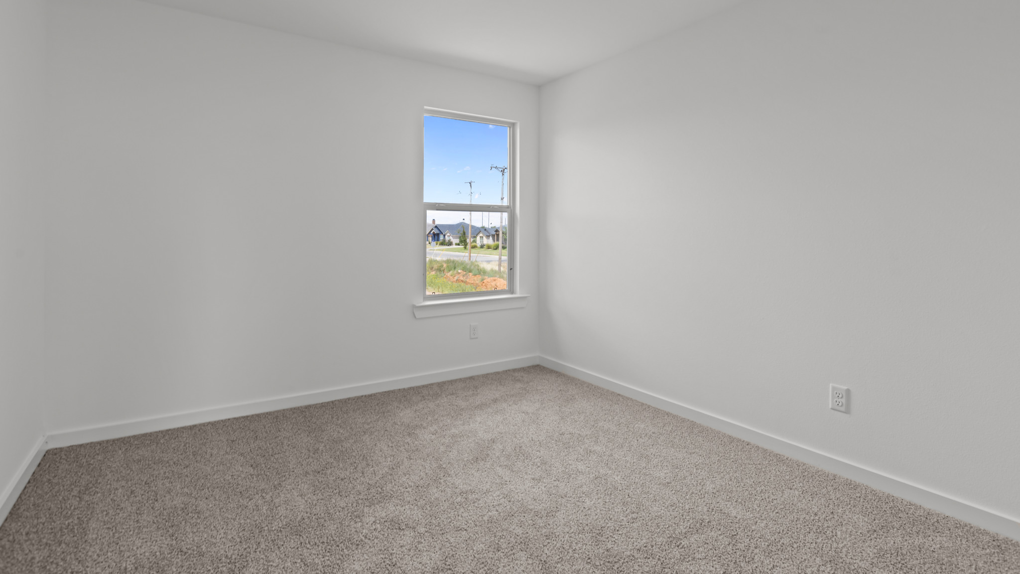 Upstairs guest bedroom 2 with plush carpet floors