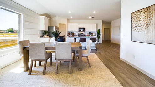 open concept kitchen and living area with vinyl plank flooring