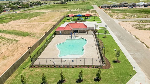Brand new Overlook West amenities center with pool, playground, and green lawn space