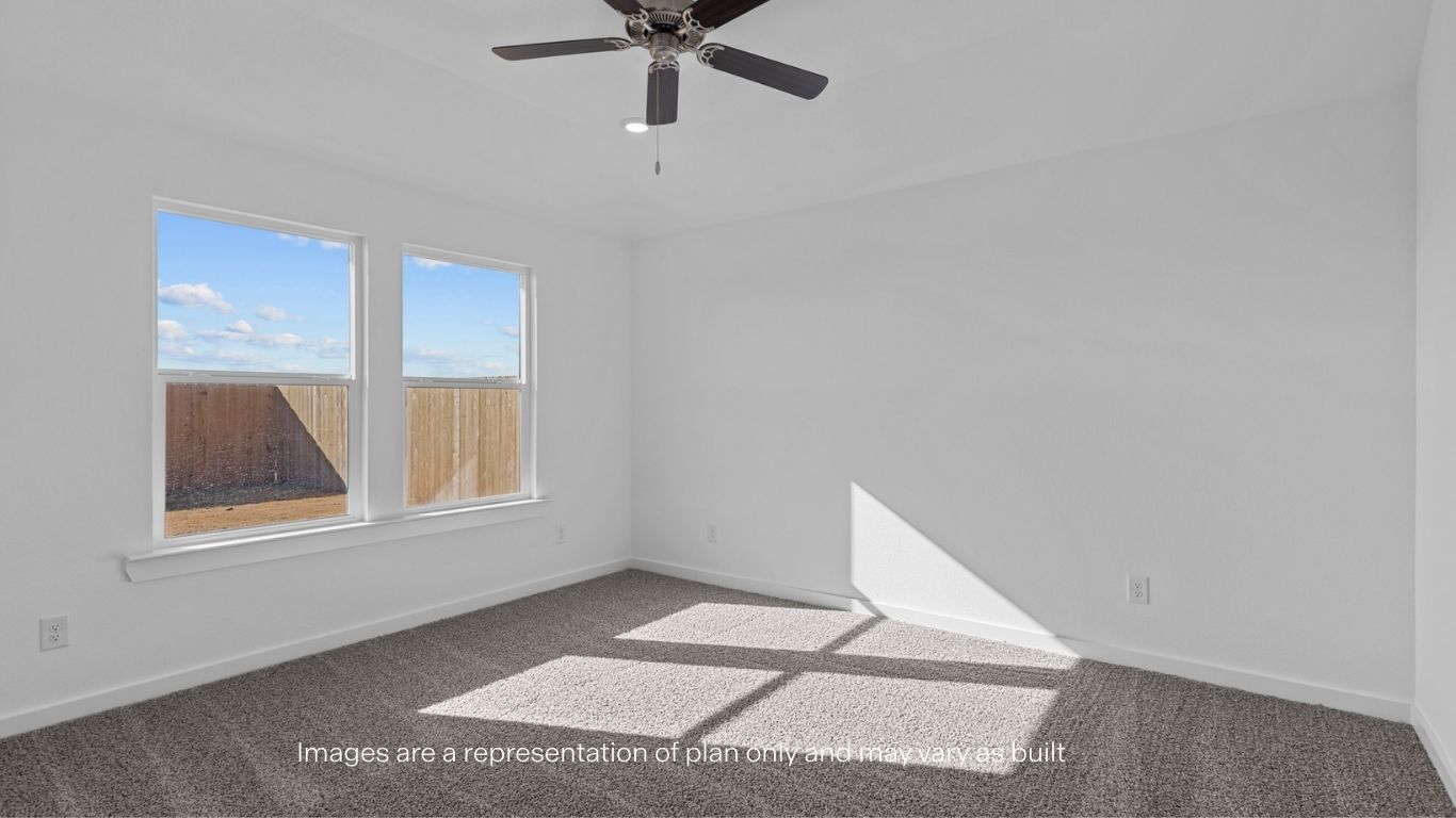 Primary bedroom with plush carpet floors and light allowing double windows