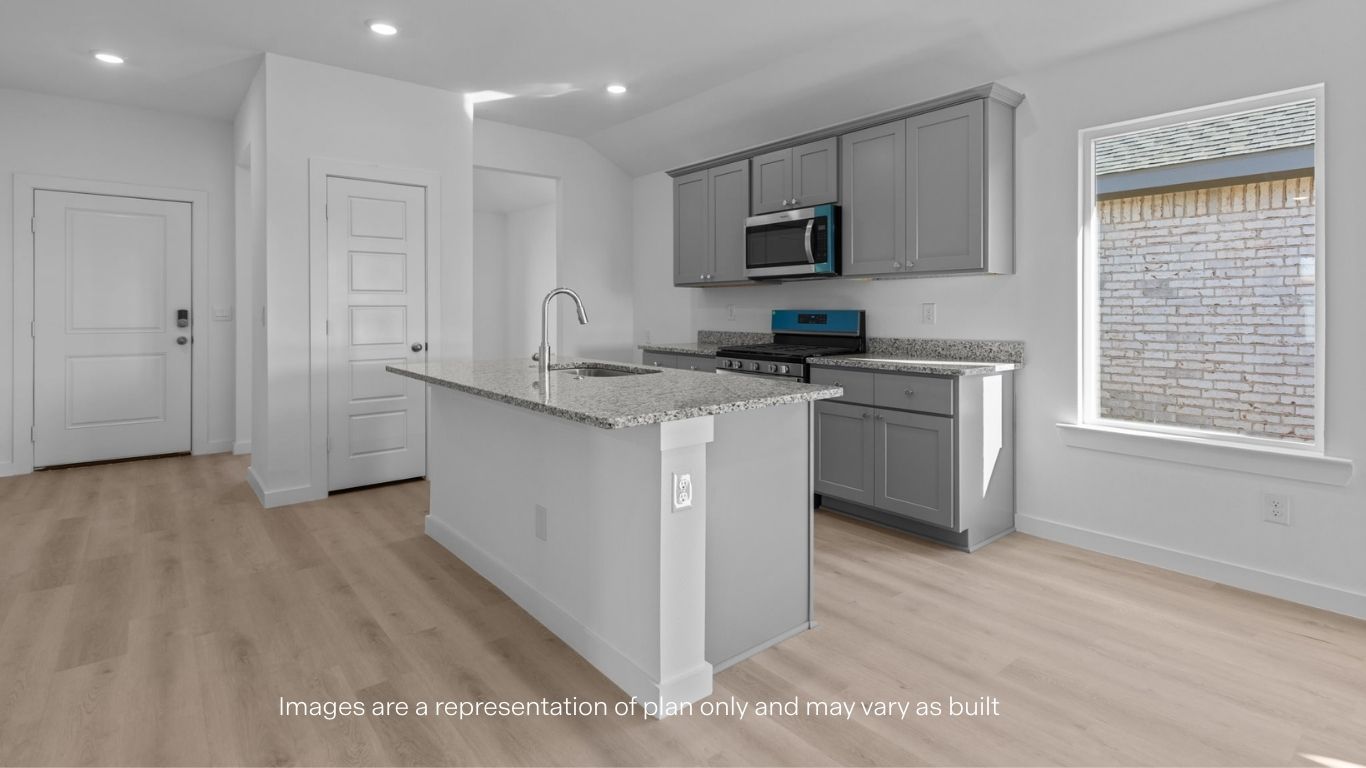 Spacious open concept kitchen with island and counter prep space