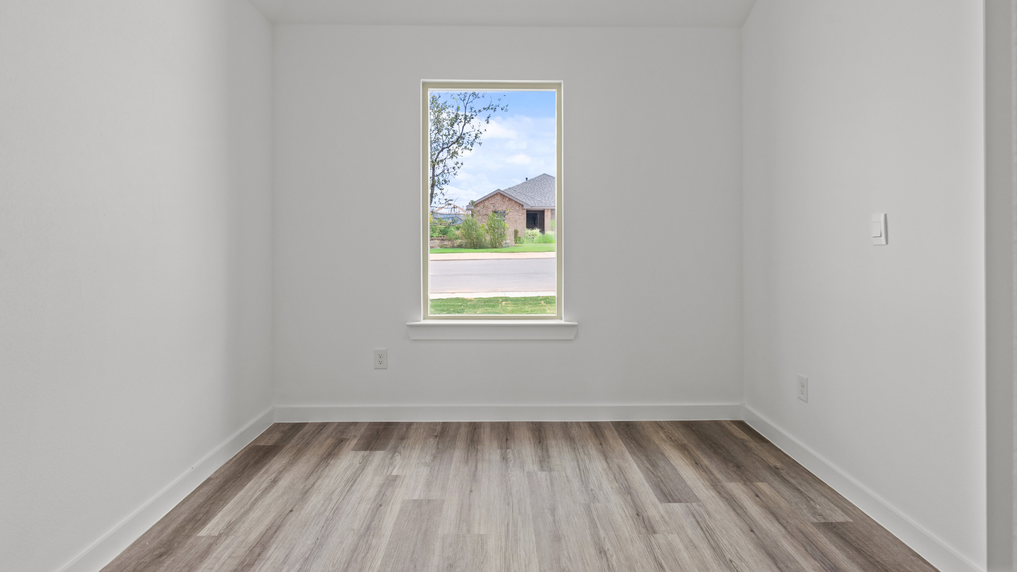 dining area with white interior and vinyl plank flooring