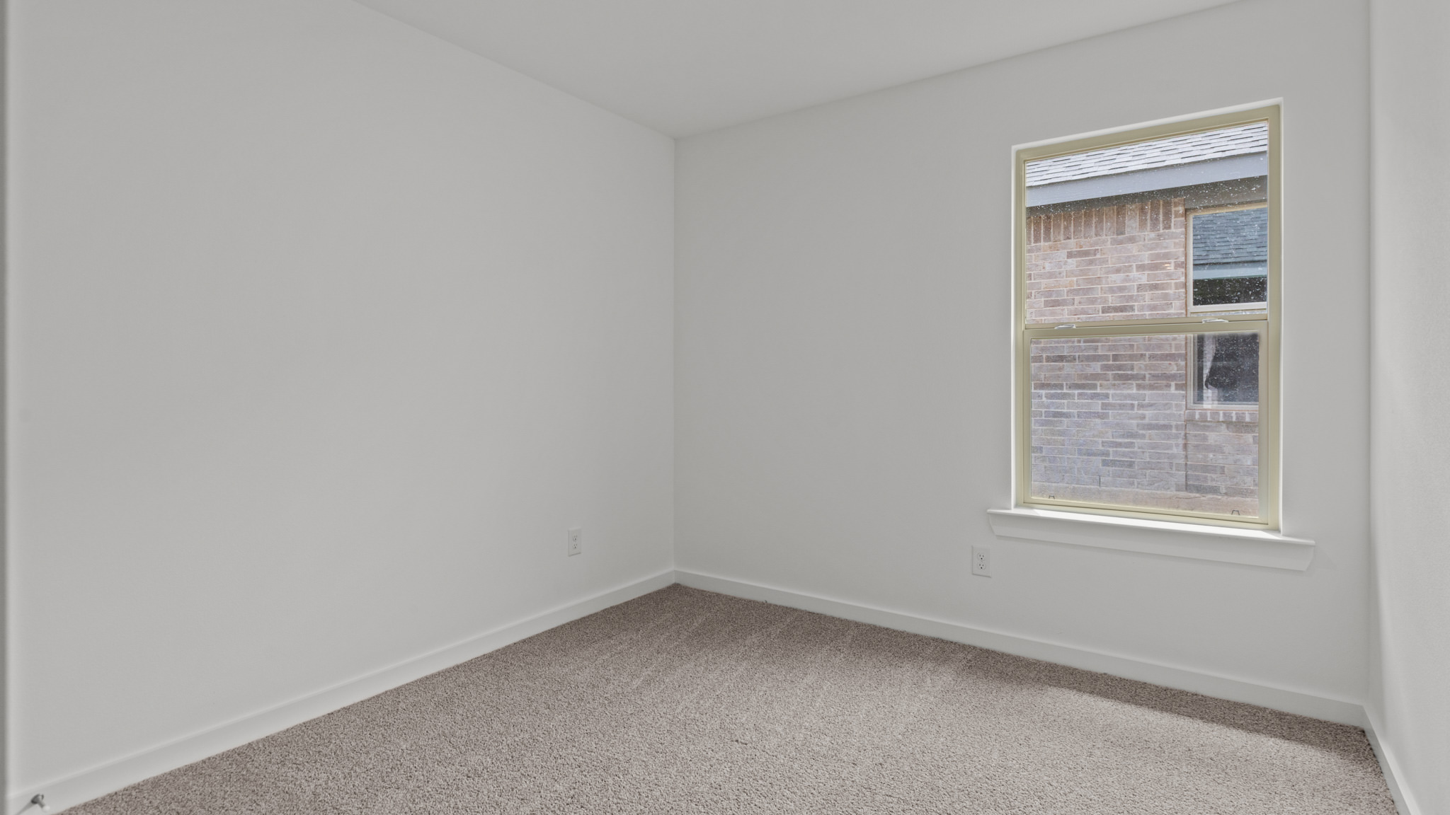 guest bedroom with plush carpet and spacious closet