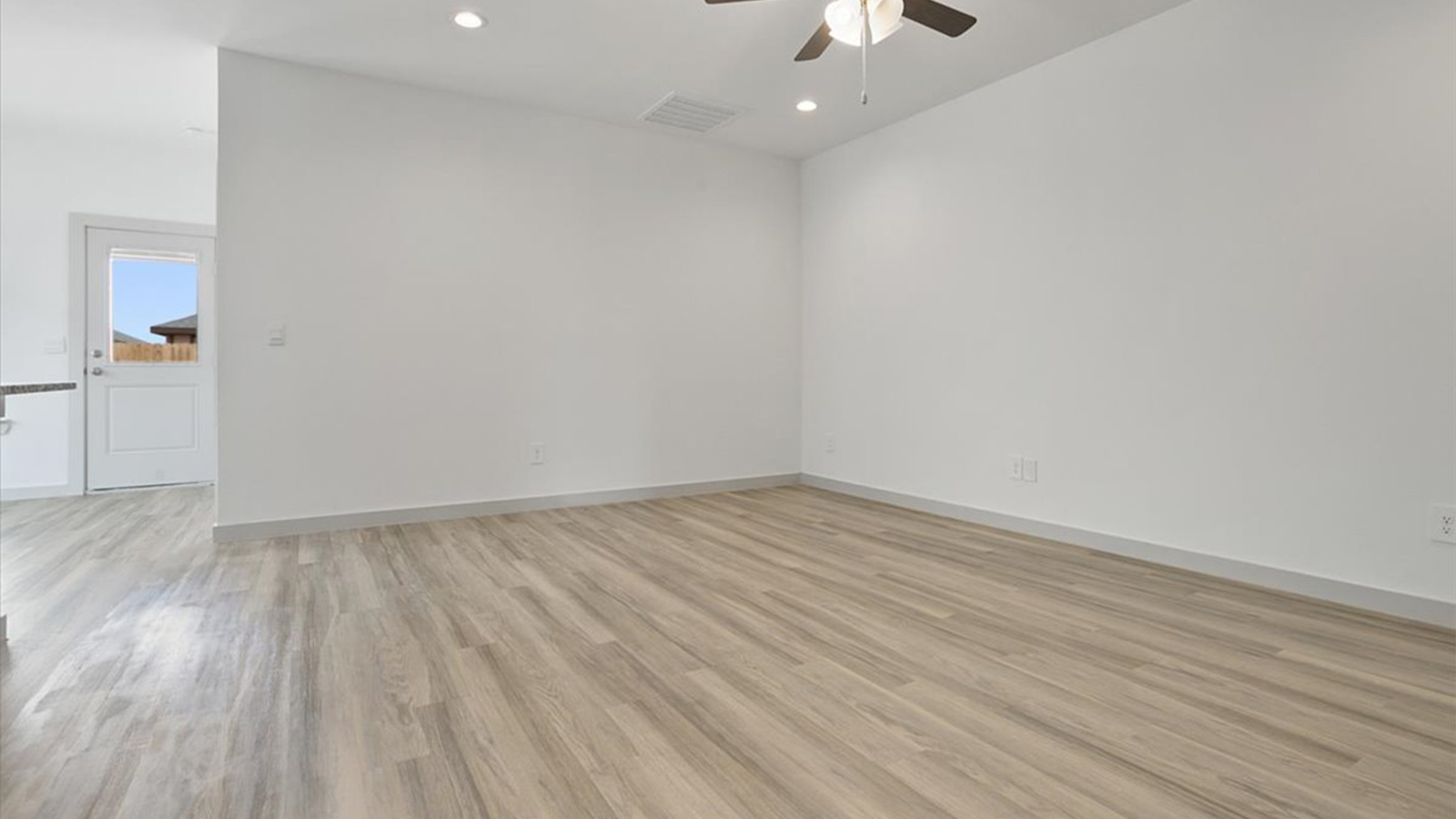 Open living and family room area with ample natural light