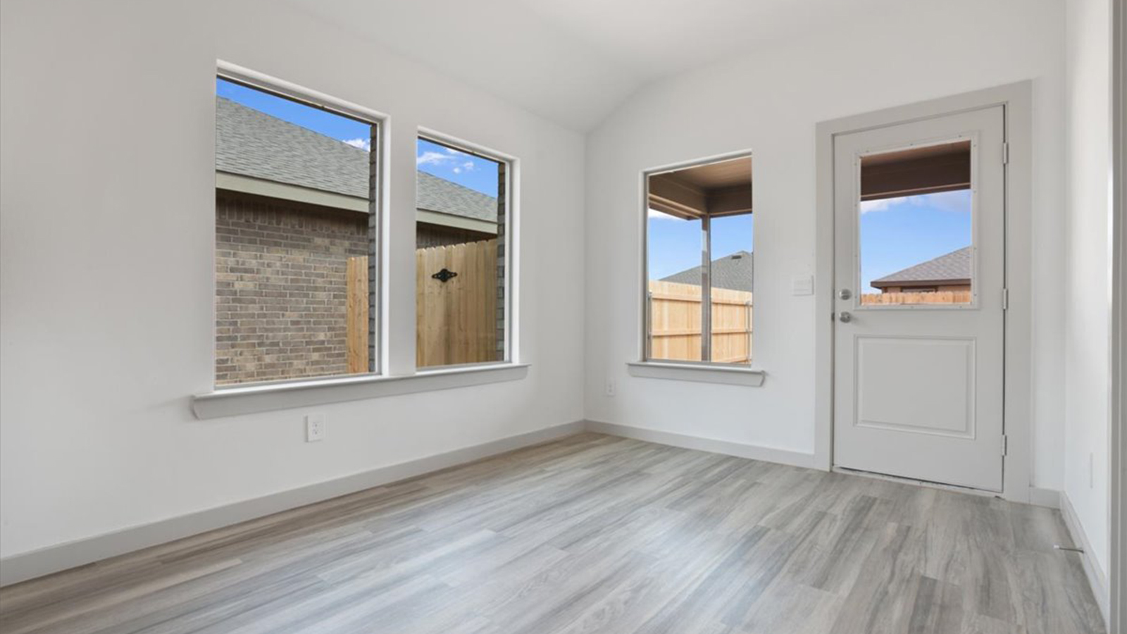Open living and family room area with ample natural light