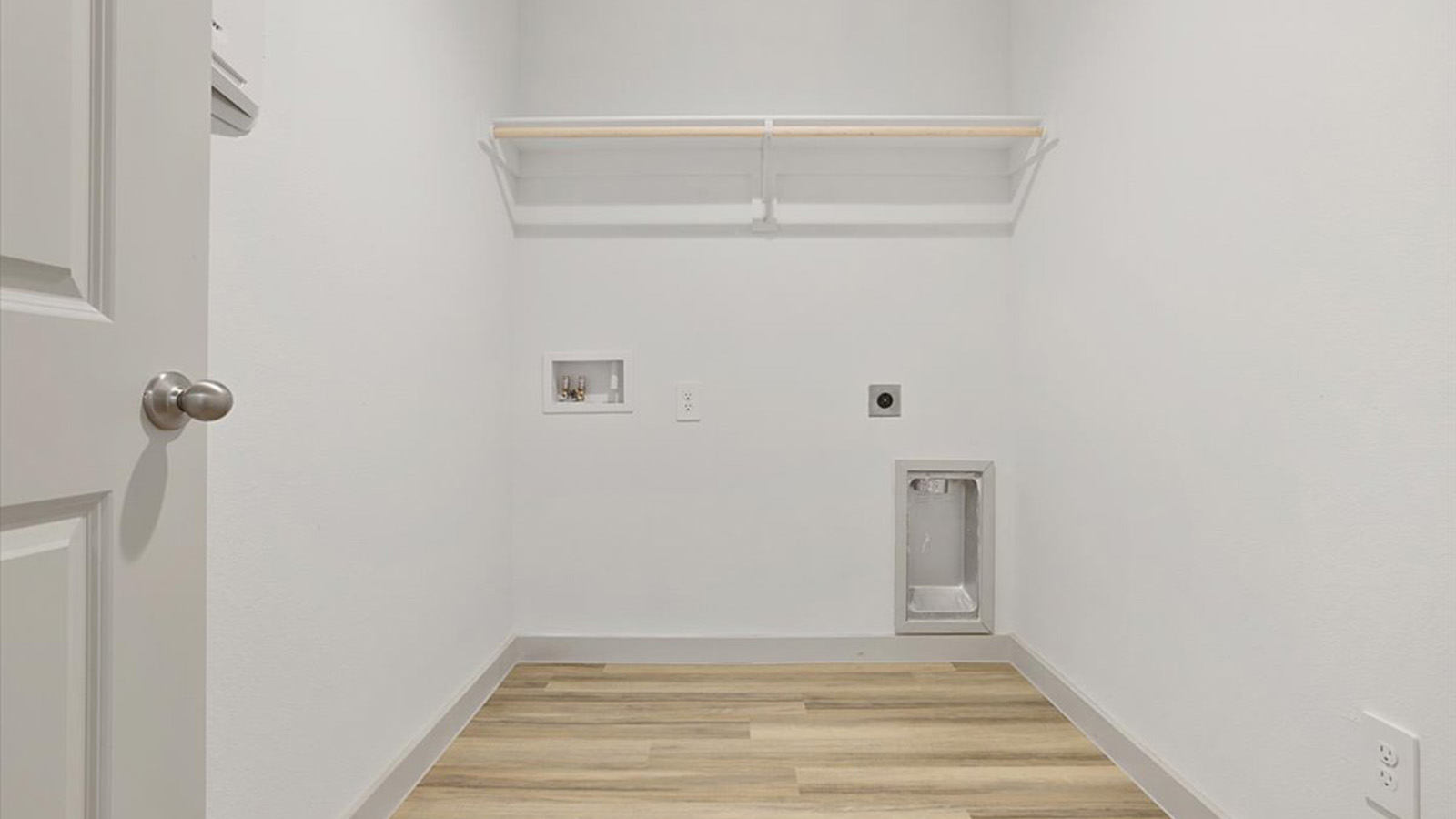 Laundry room and utility closet space with extra storage