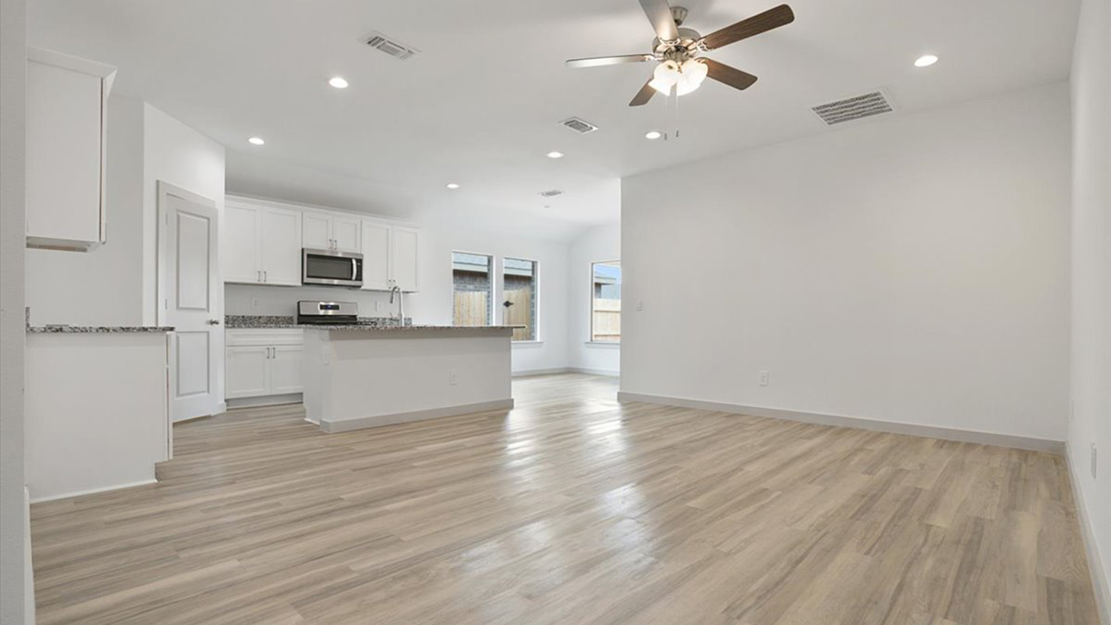 Open concept kitchen, living, family, and dining room space